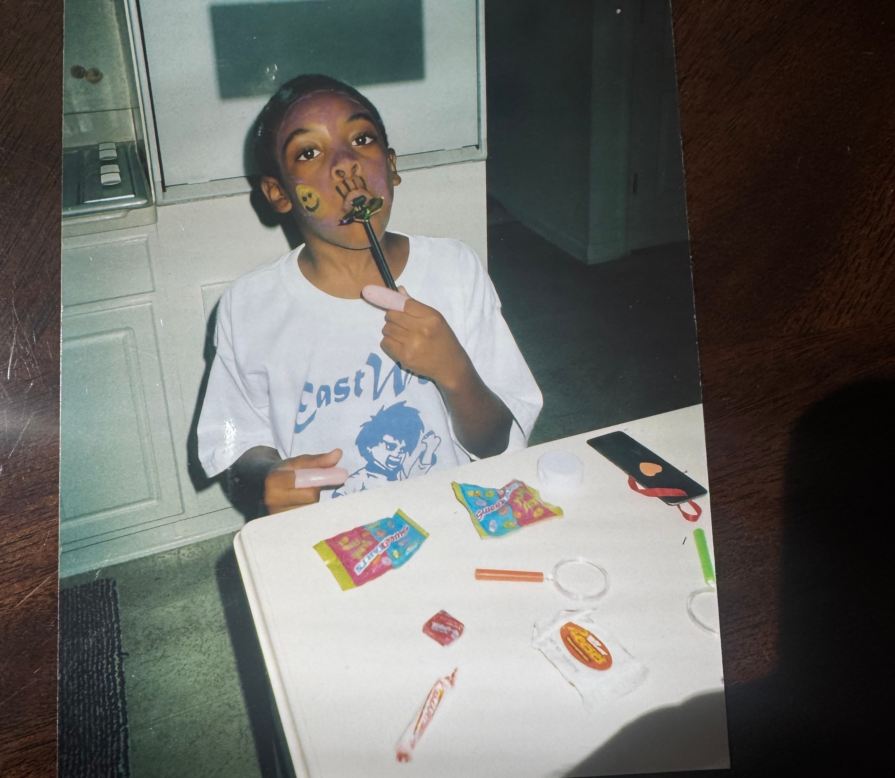 Young Anthony with face paint, pure joy